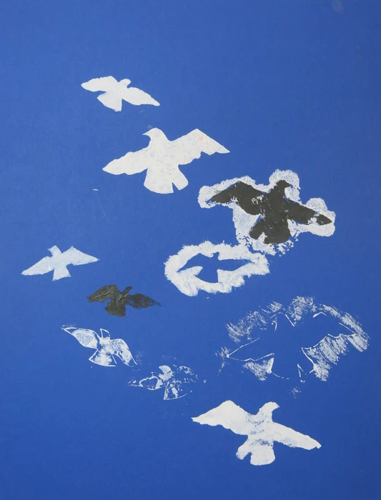 A monoprint with a royal blue background and 10 birds of various sizes on the print. Two birds are black and the others are white. Most of the birds are positive forms, but two were are created by loosely painting/printing their negative. One black bird is surrounded by white. The print is loose and the viewers eye is continuously drawn upwards on the print.