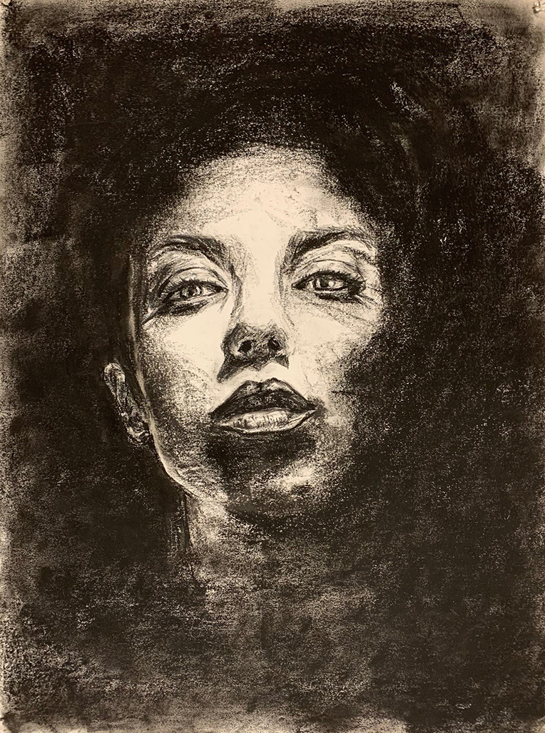Black and white charcoal drawing of a woman's face