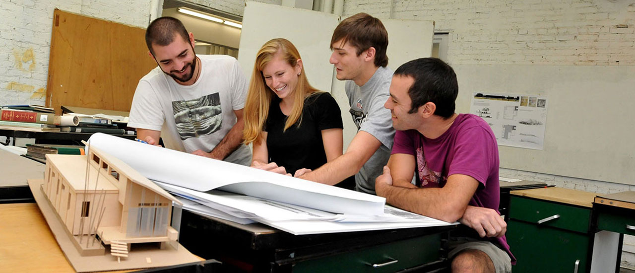 Architectural Technology students reading blueprints.
